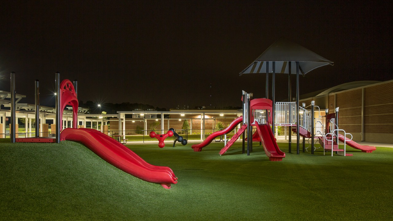 Nighttime artificial turf playground by Southwest Greens of Huntsville